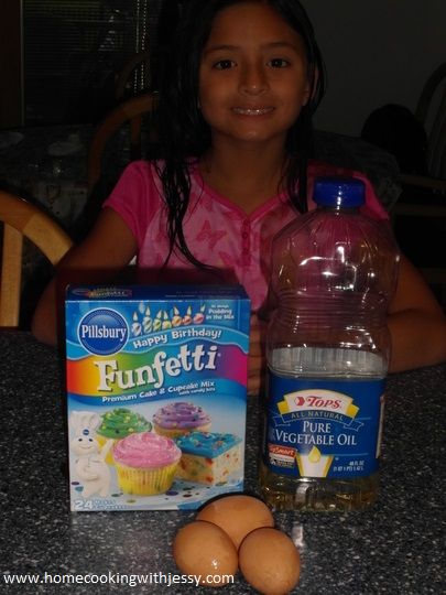preparing to bake confetti cupcakes to share to her friends at school for her birthday party